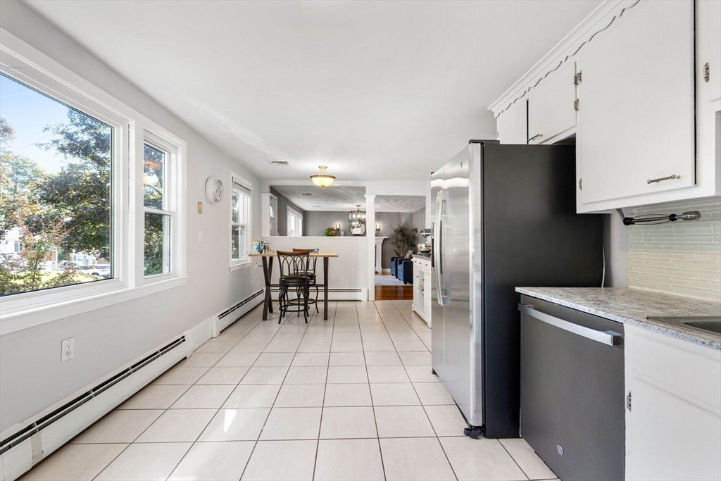 10 Marie Avenue Stoneham, MA 02180 - Photo 5 of 41 a kitchen with stainless steel appliances a refrigerator and a stove top oven