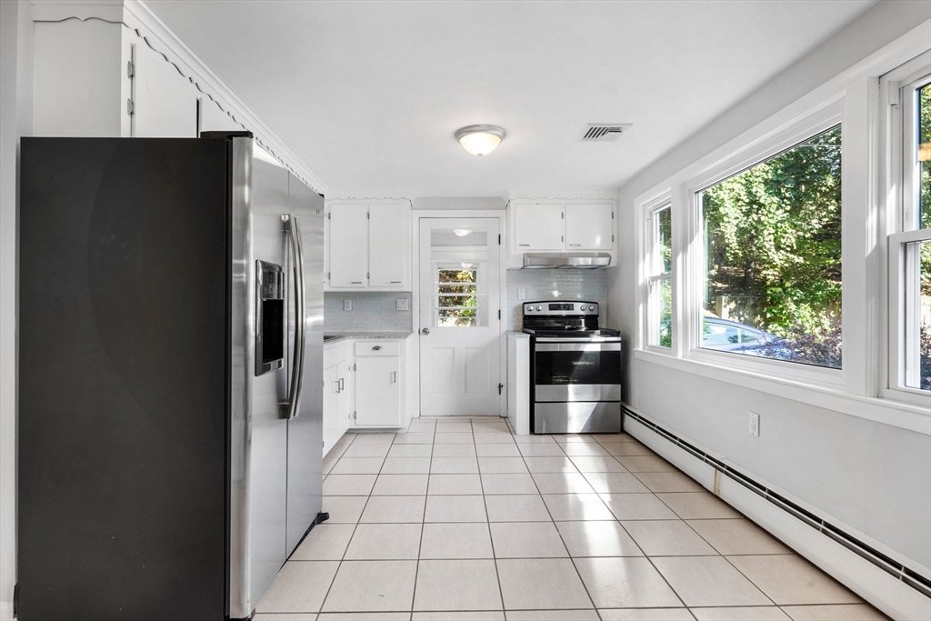 10 Marie Avenue Stoneham, MA 02180 - Photo 7 of 41 a kitchen with a refrigerator a sink and a stove