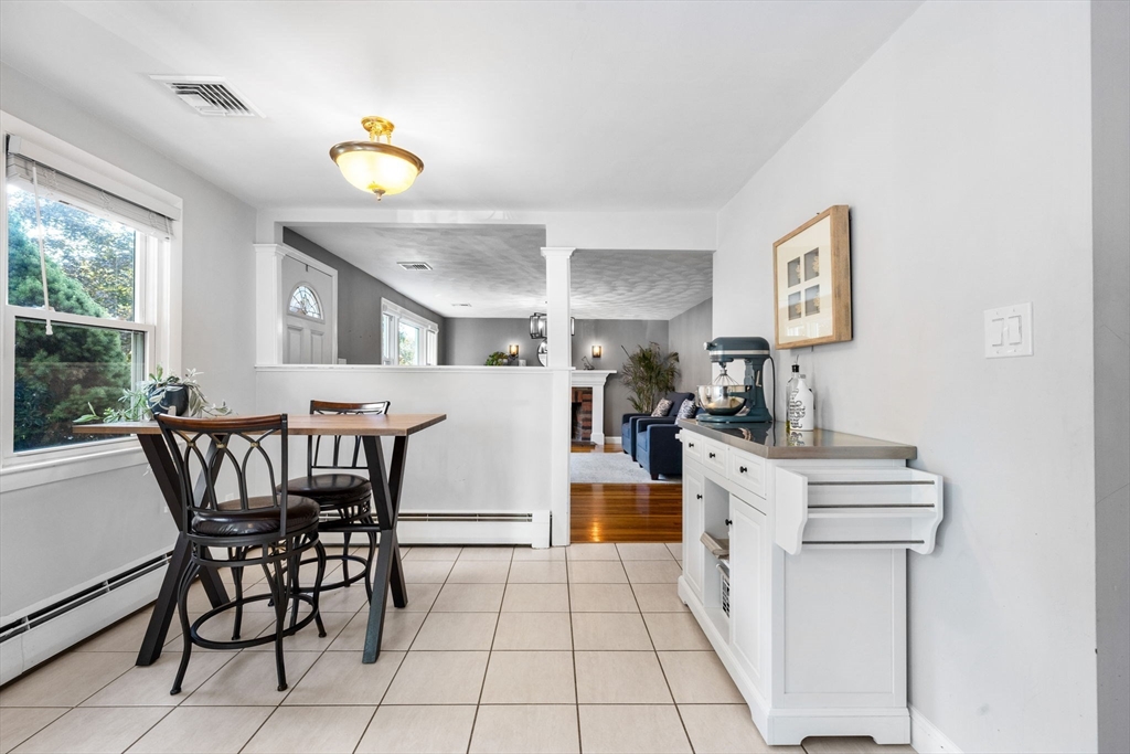 10 Marie Avenue Stoneham, MA 02180 - Photo 9 of 41 a view of a dining room with furniture and a chandelier
