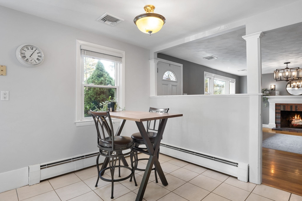 10 Marie Avenue Stoneham, MA 02180 - Photo 10 of 41 a view of a dining room with furniture and a chandelier