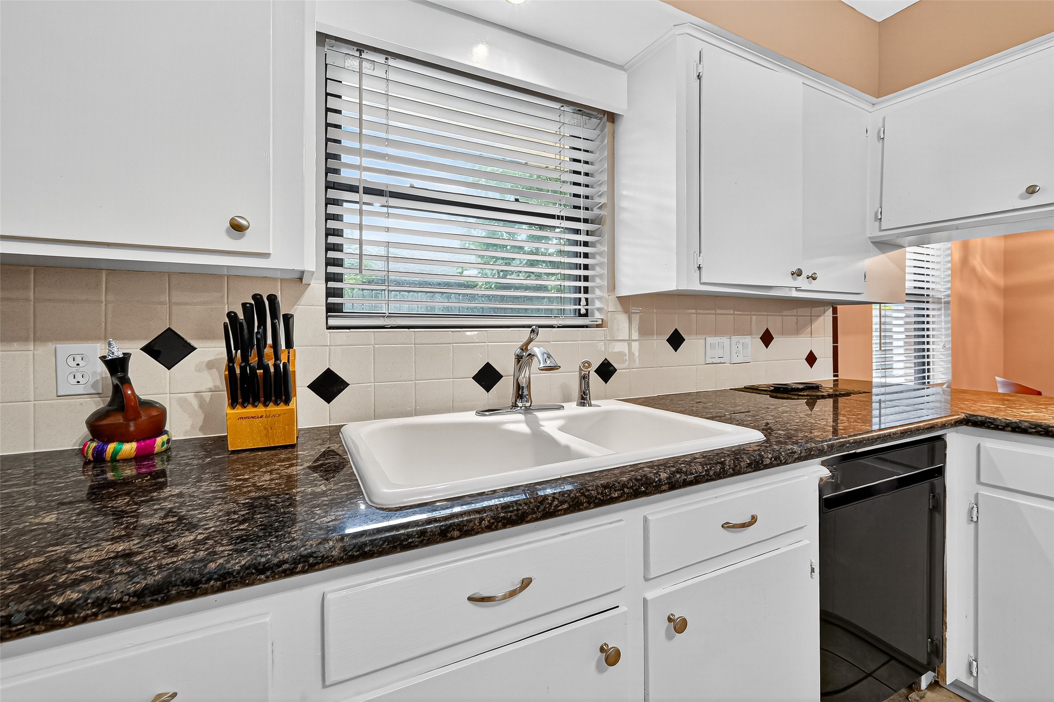 5734 Sanford Road Houston, TX 77096 - Photo 12 of 48 a kitchen with counter space and a sink