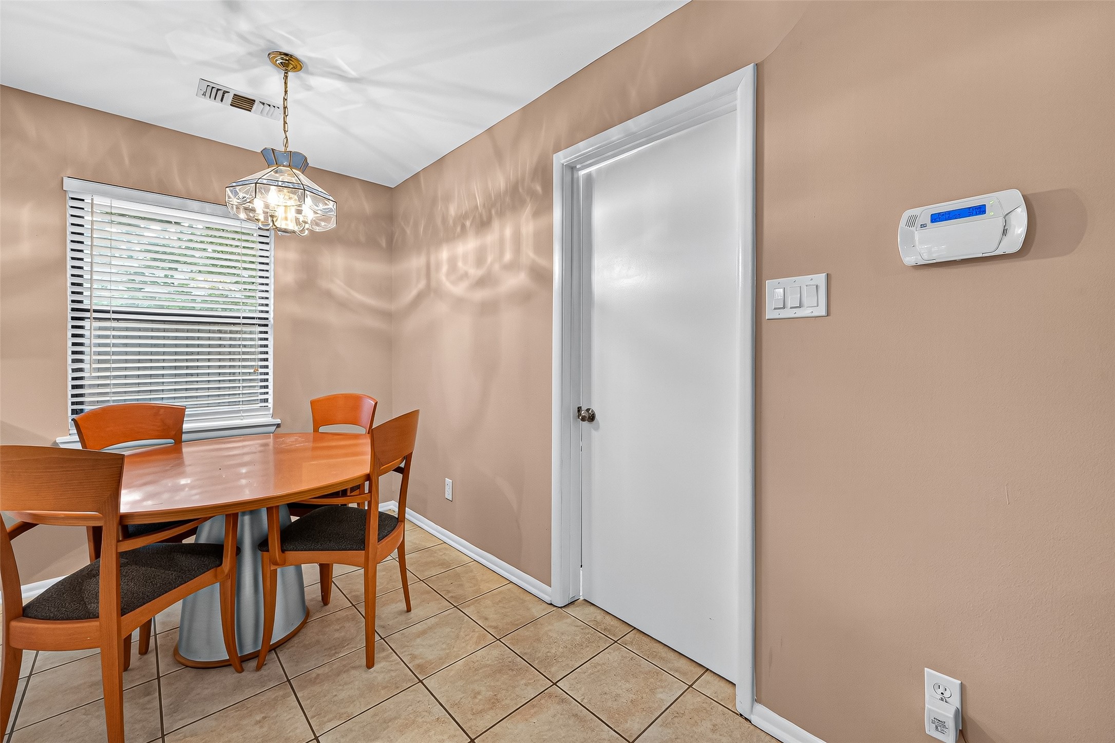 5734 Sanford Road Houston, TX 77096 - Photo 15 of 48 a view of a dining room with furniture and chandelier
