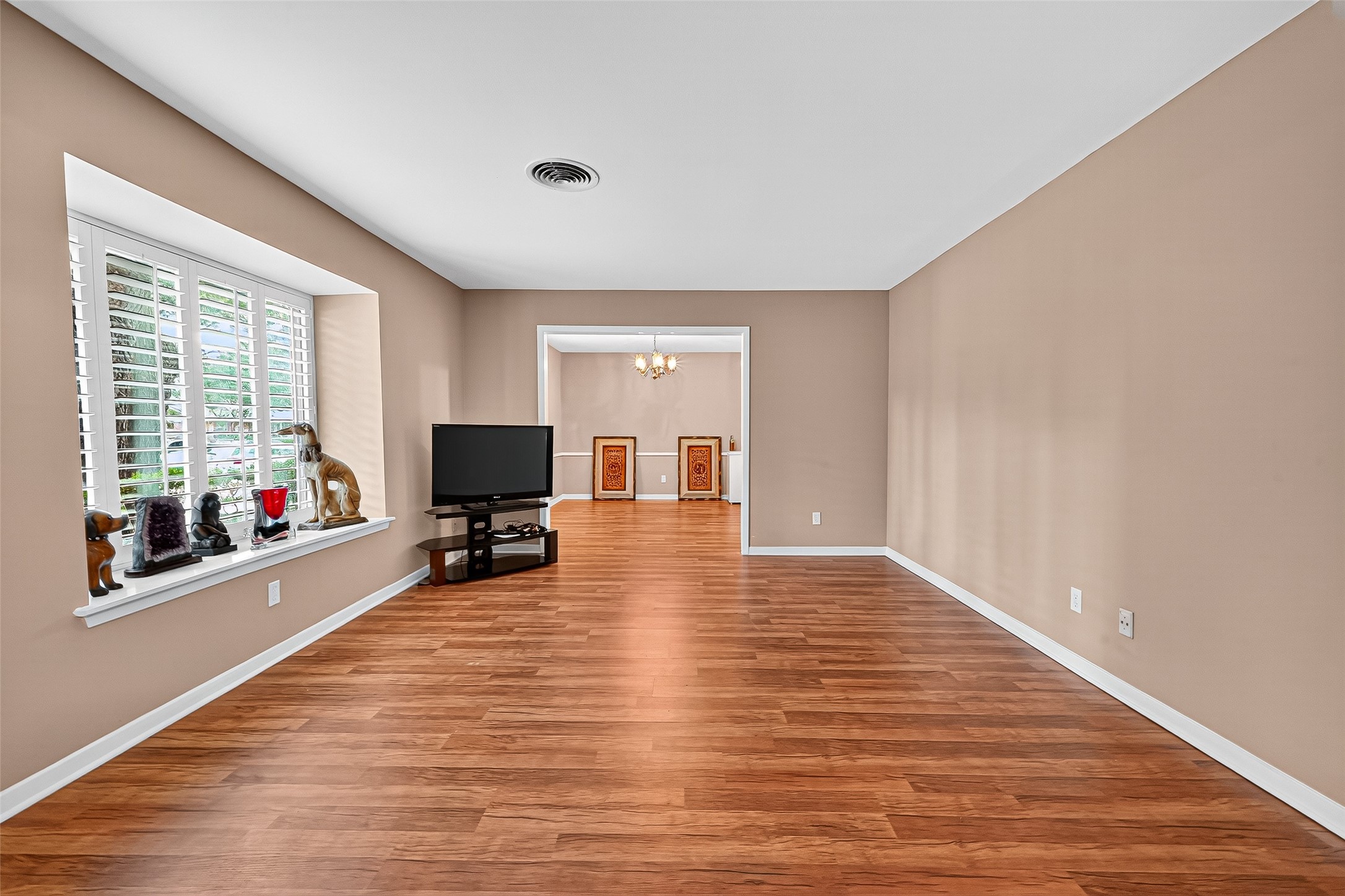 5734 Sanford Road Houston, TX 77096 - Photo 18 of 48 a living room with furniture and a flat screen tv