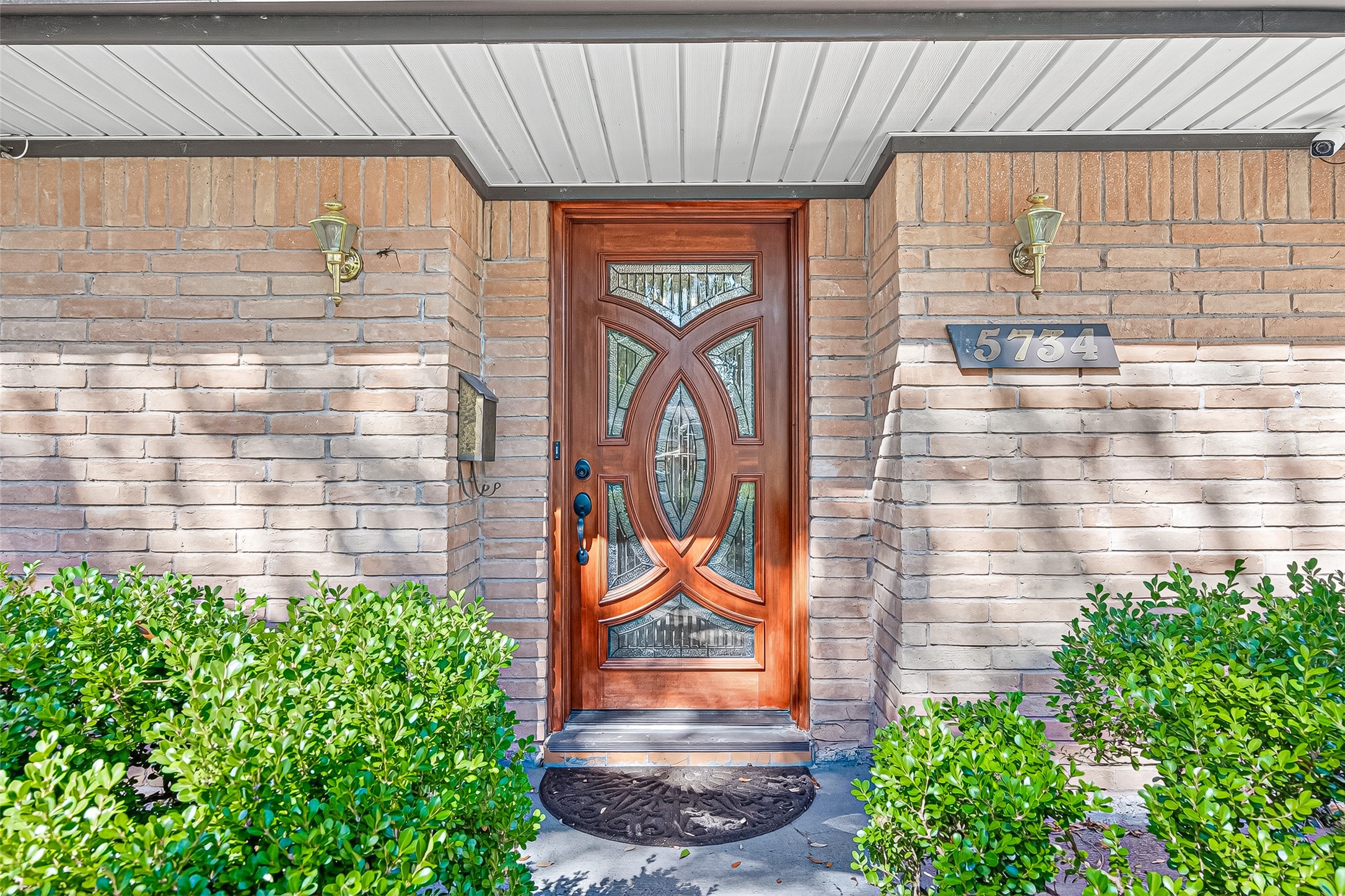 5734 Sanford Road Houston, TX 77096 - Photo 2 of 48 a front view of a house with garden