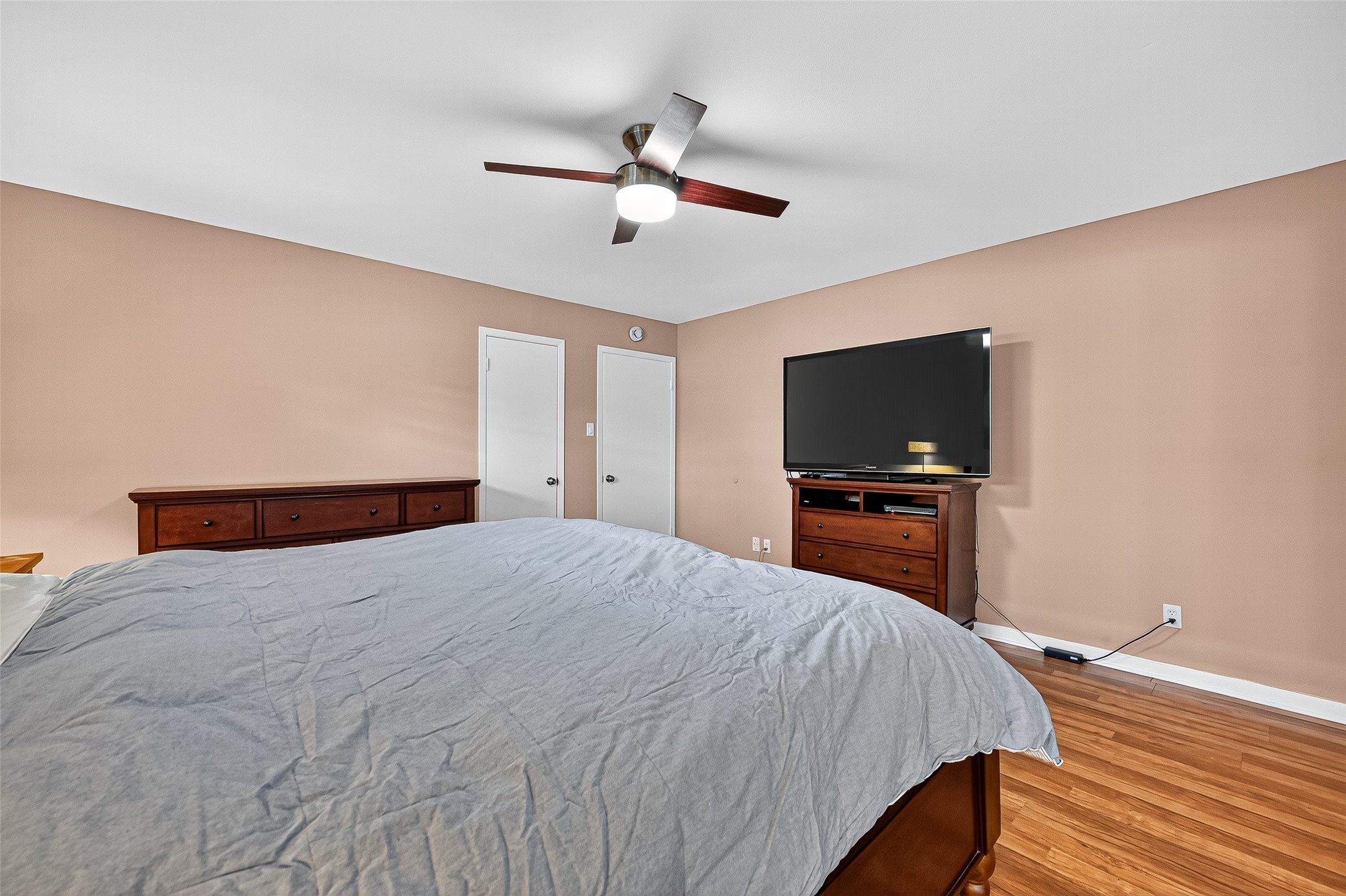 5734 Sanford Road Houston, TX 77096 - Photo 26 of 48 a bedroom with a bed and a flat screen tv