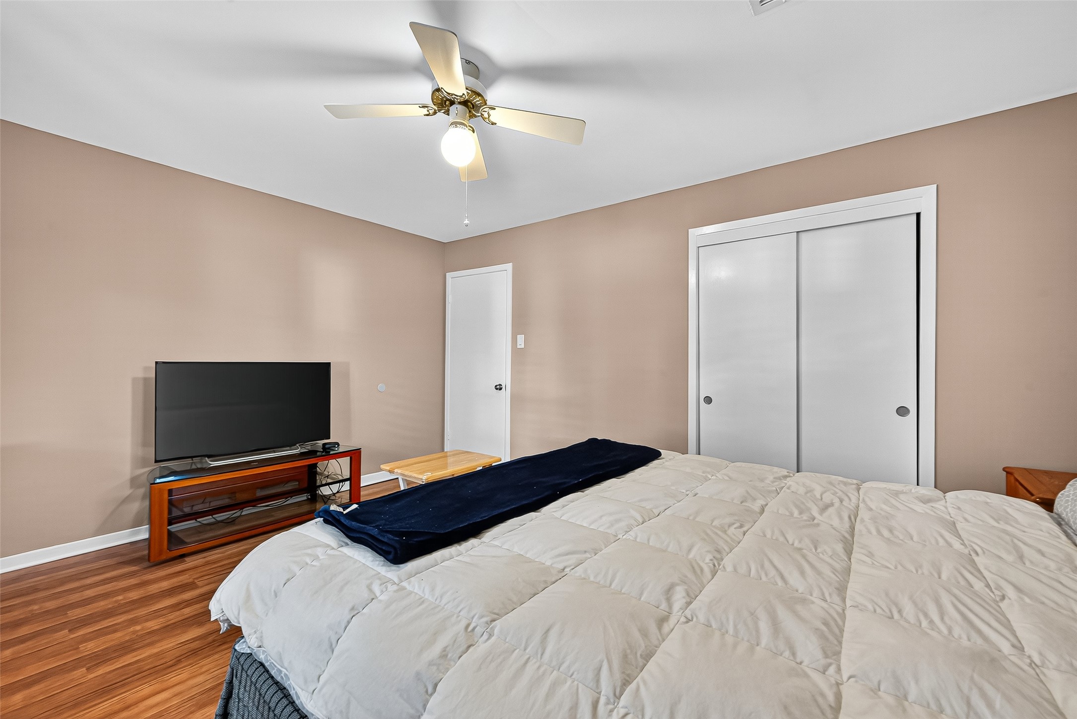 5734 Sanford Road Houston, TX 77096 - Photo 28 of 48 a bedroom with a bed and a flat screen tv