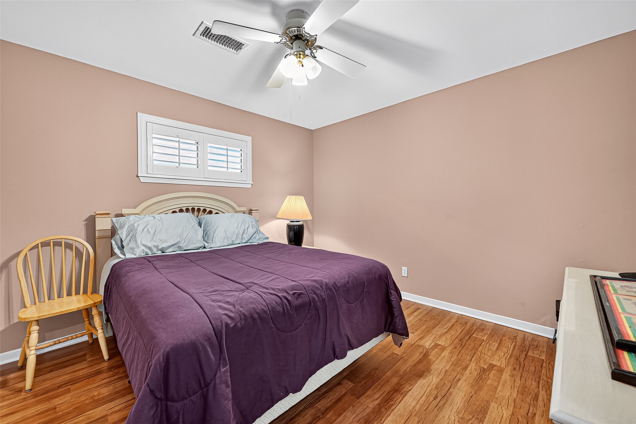 5734 Sanford Road Houston, TX 77096 - Photo 30 of 48 a bedroom with a bed and a chandelier