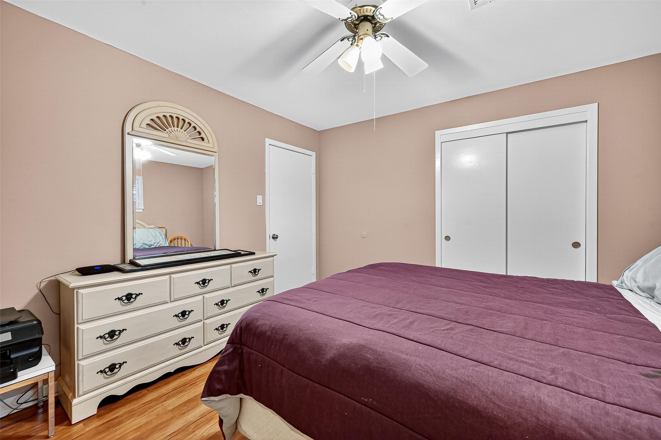 5734 Sanford Road Houston, TX 77096 - Photo 31 of 48 a bedroom with a bed and a dresser