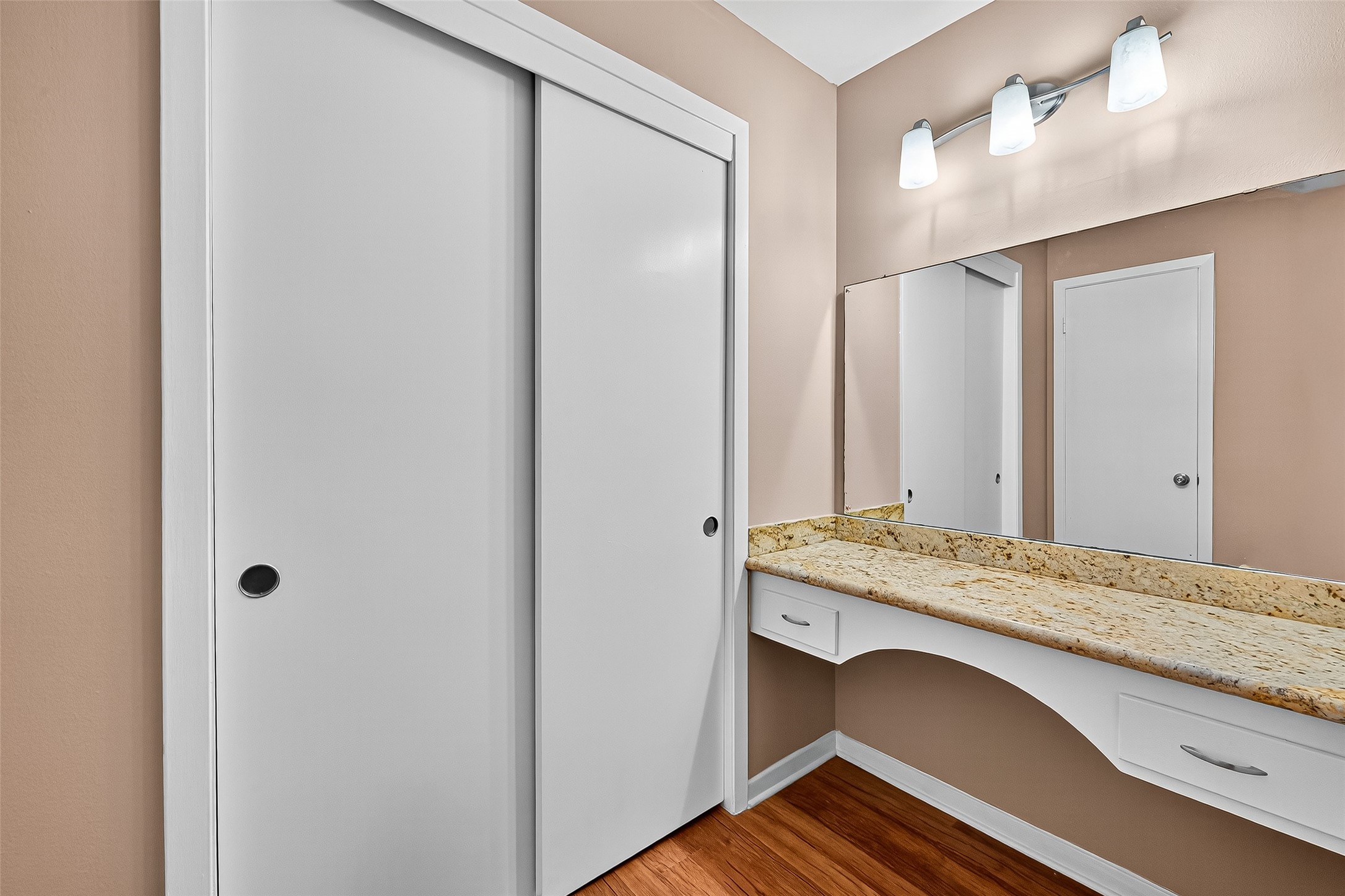 5734 Sanford Road Houston, TX 77096 - Photo 33 of 48 a en suite bathroom with a granite countertop sink and a mirror