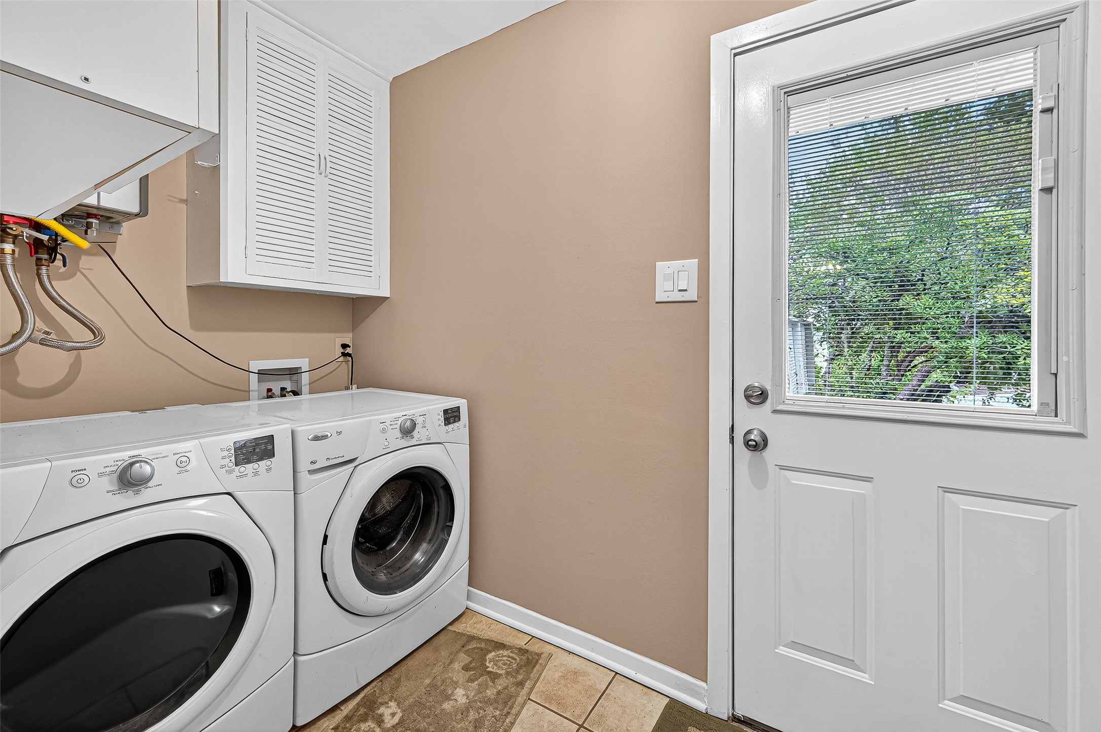 5734 Sanford Road Houston, TX 77096 - Photo 35 of 48 a utility room with dryer and washer