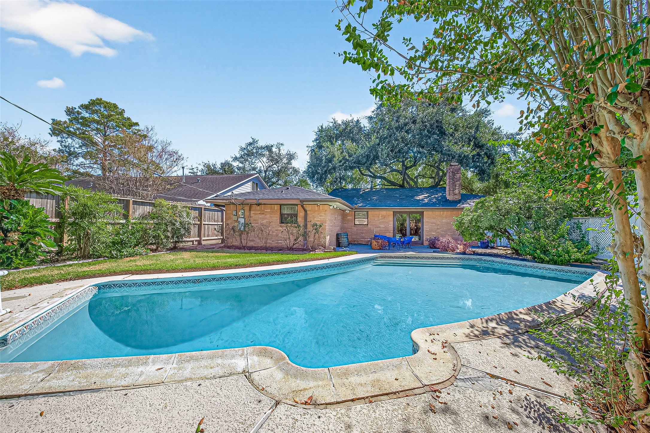 5734 Sanford Road Houston, TX 77096 - Photo 38 of 48 a view of a swimming pool with a yard