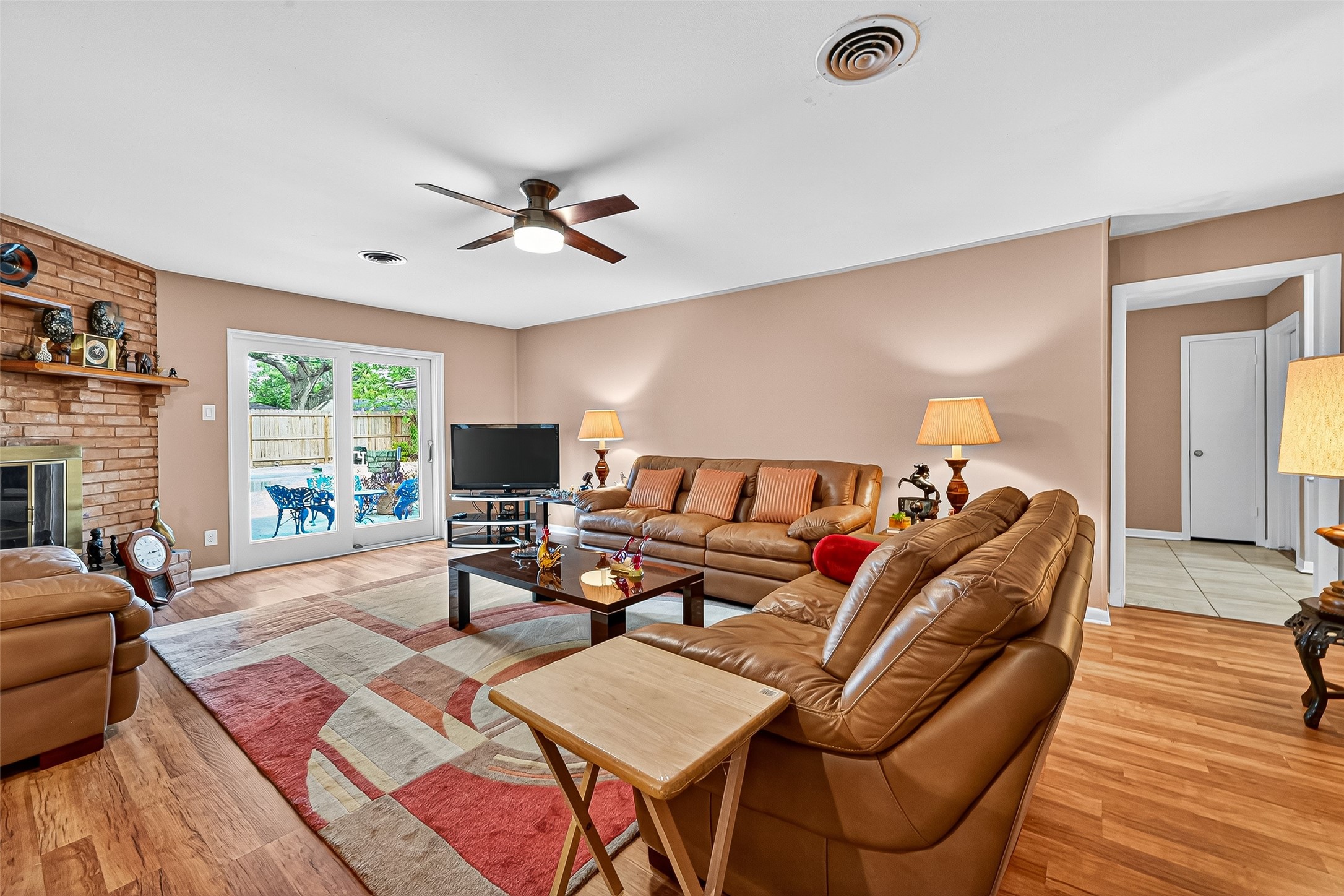 5734 Sanford Road Houston, TX 77096 - Photo 4 of 48 a living room with furniture a flat screen tv and a large window