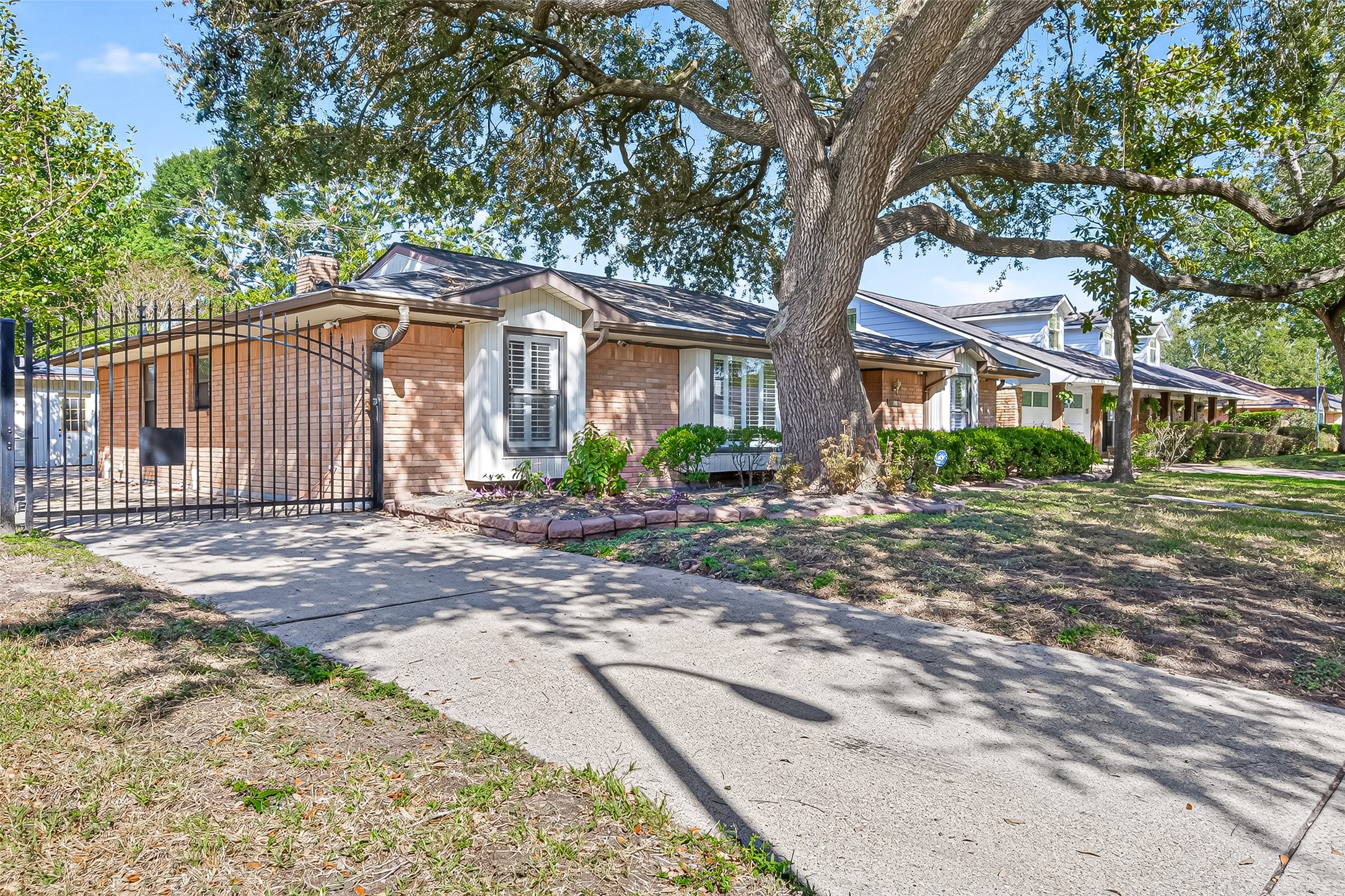 5734 Sanford Road Houston, TX 77096 - Photo 45 of 48 a front view of a house with a garden
