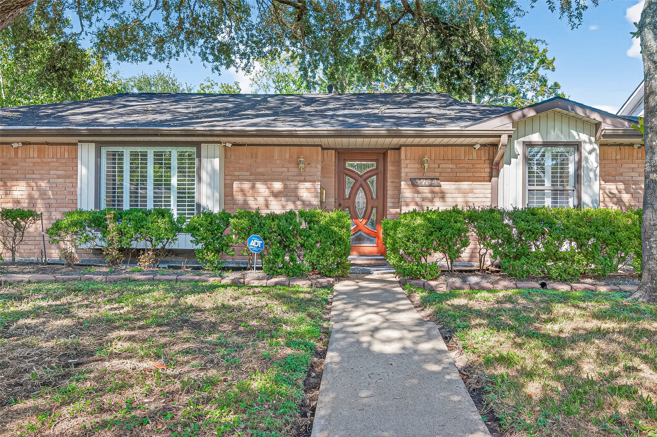 5734 Sanford Road Houston, TX 77096 - Photo 48 of 48 a front view of a house with garden