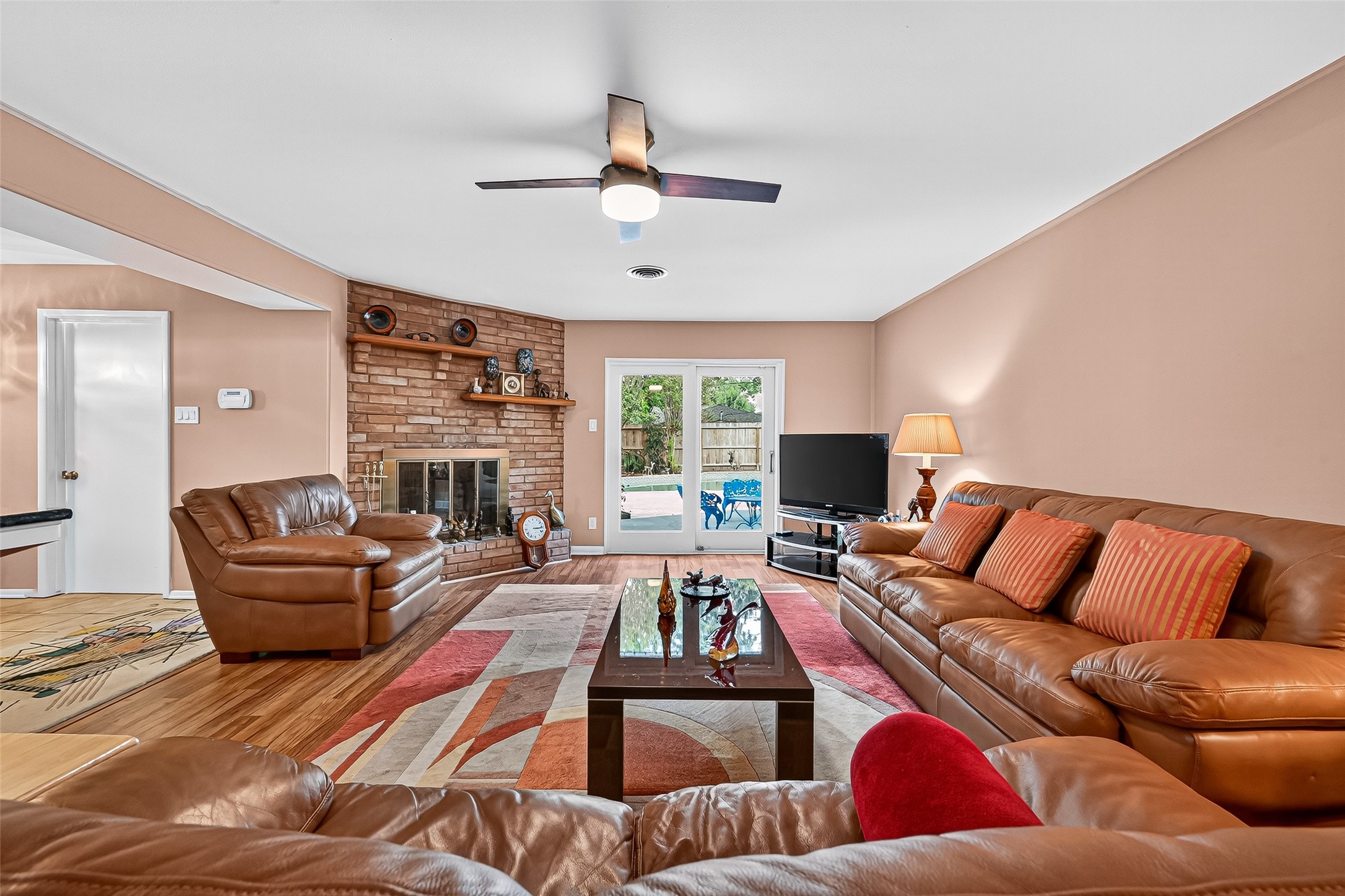 5734 Sanford Road Houston, TX 77096 - Photo 5 of 48 a living room with furniture fireplace and a large window