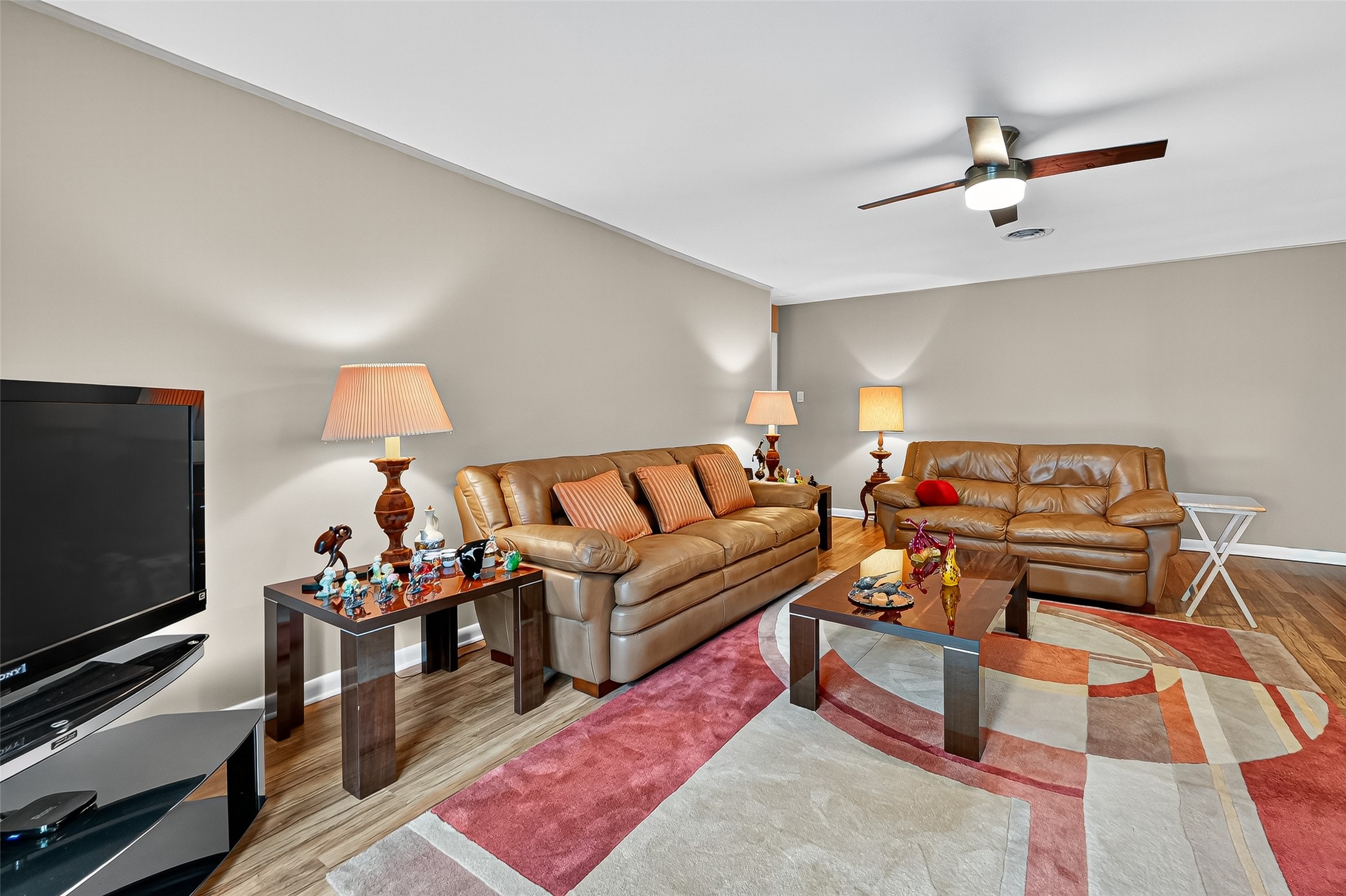 5734 Sanford Road Houston, TX 77096 - Photo 7 of 48 a living room with furniture and a flat screen tv