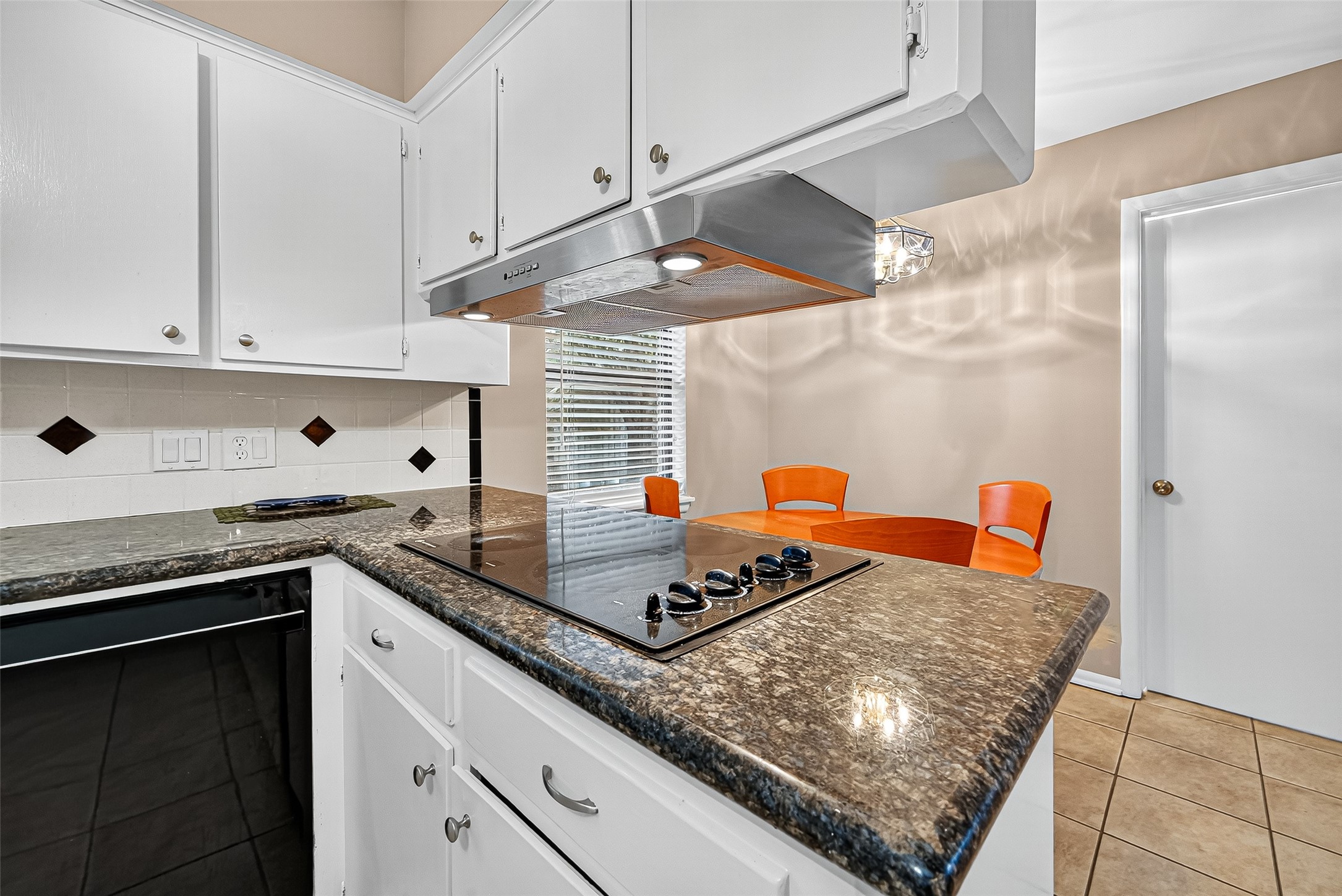 5734 Sanford Road Houston, TX 77096 - Photo 10 of 48 a kitchen with stainless steel appliances granite countertop a sink dishwasher and a stove with wooden cabinets