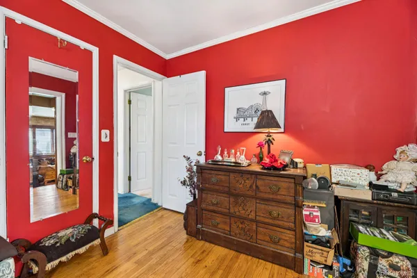 a bed room with a bed and a television