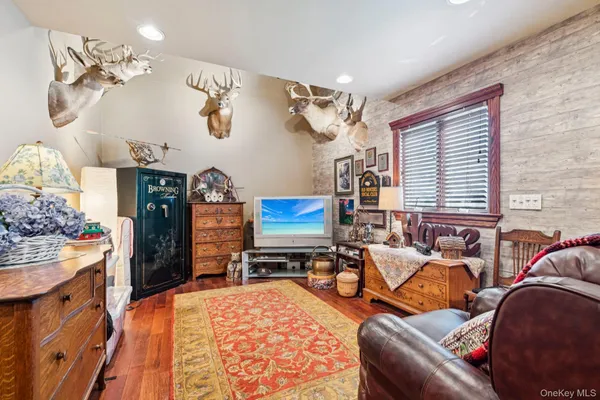 a bedroom with furniture and a chandelier