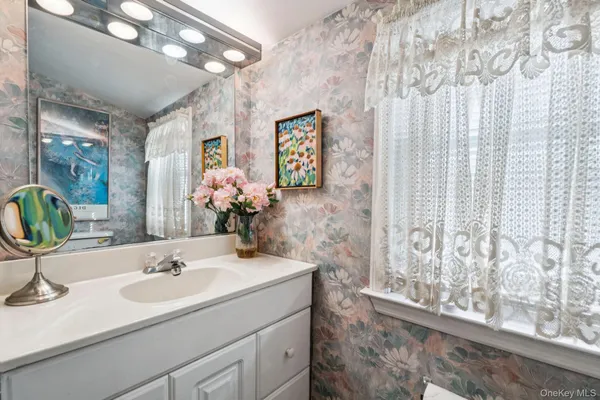 a bathroom with a sink and a mirror