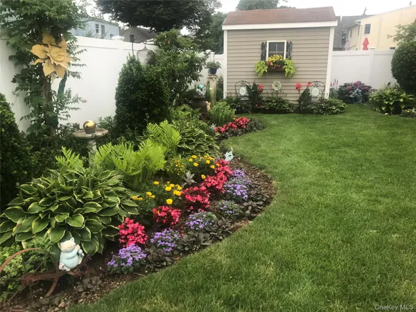 a view of a potted plant sitting in front of a house