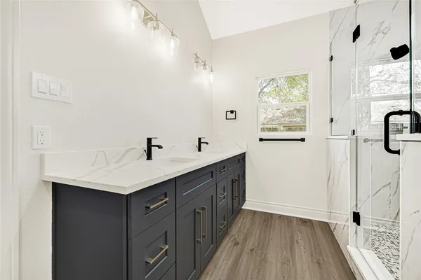 a kitchen with a sink a window and appliances