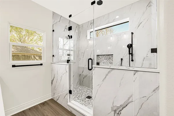 a view of kitchen with wooden floor and window