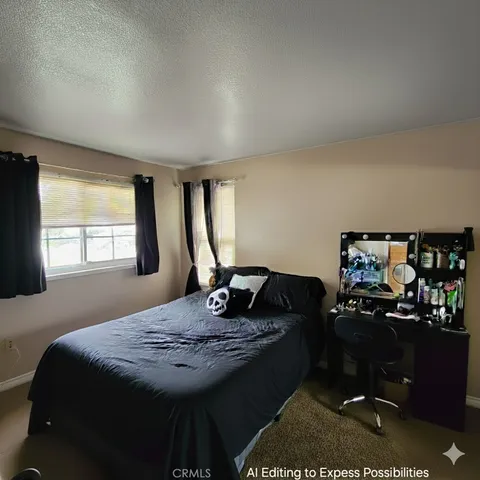 a bedroom with a bed and dresser