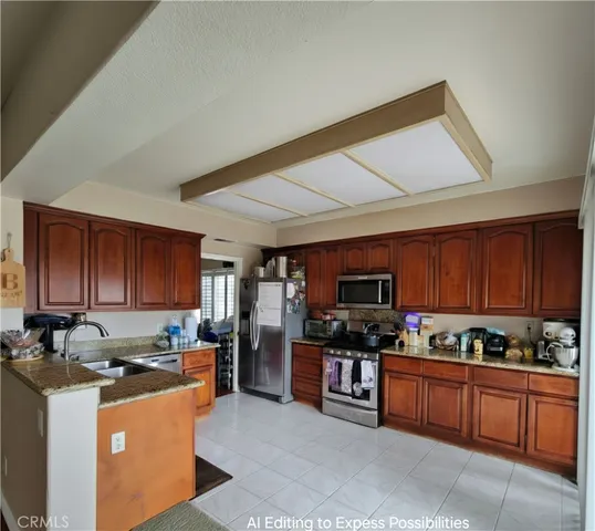 a kitchen with stainless steel appliances wooden cabinets a stove top oven a sink and dishwasher