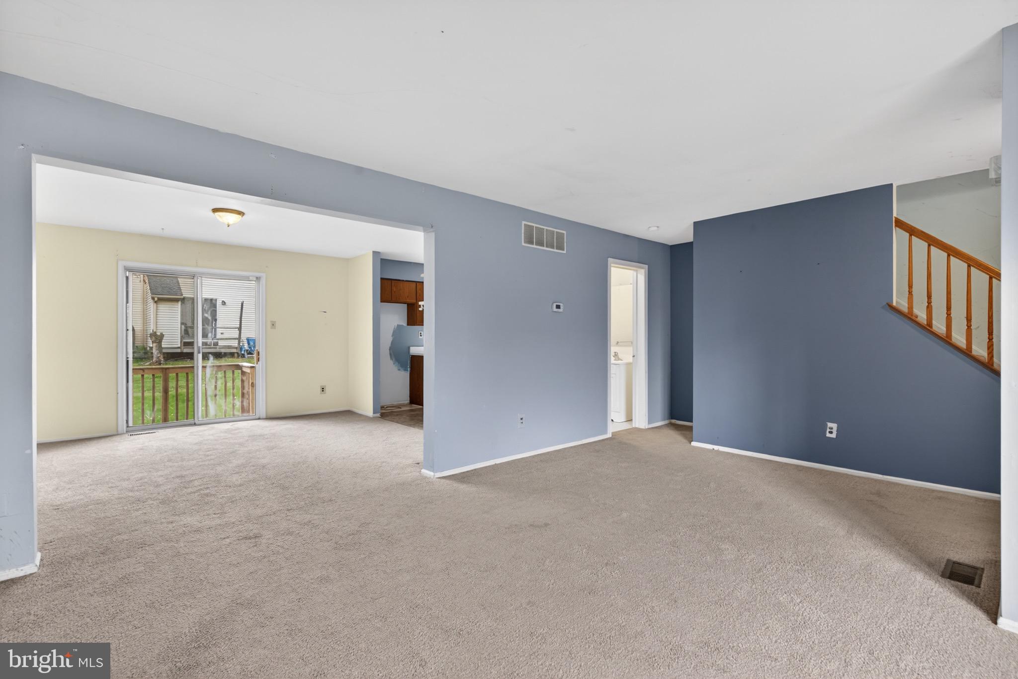228 Goshen Road Schwenksville, PA 19473 - Photo 2 of 14 a view of an empty room with wooden floor and a window