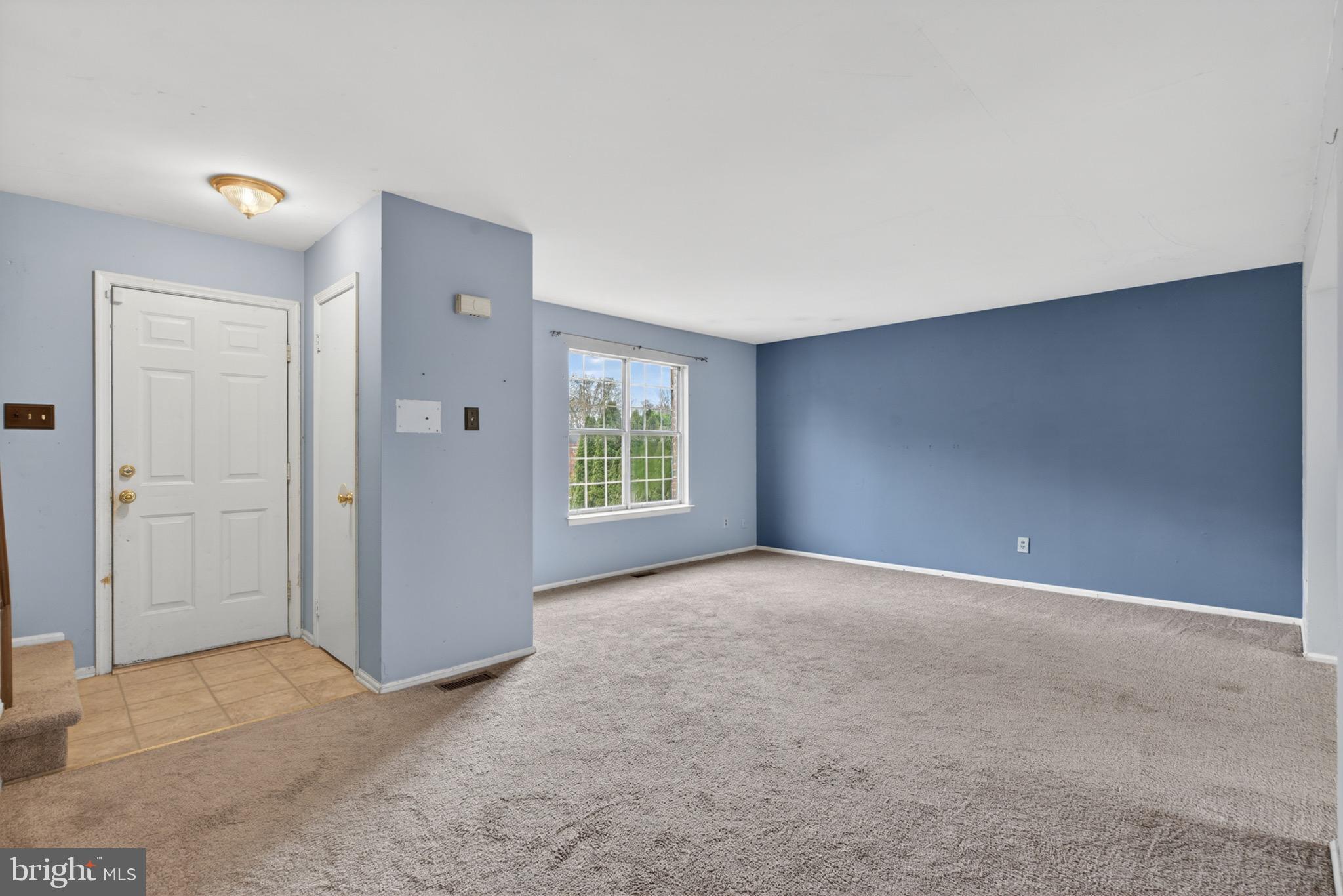 228 Goshen Road Schwenksville, PA 19473 - Photo 4 of 14 an empty room with windows and closet