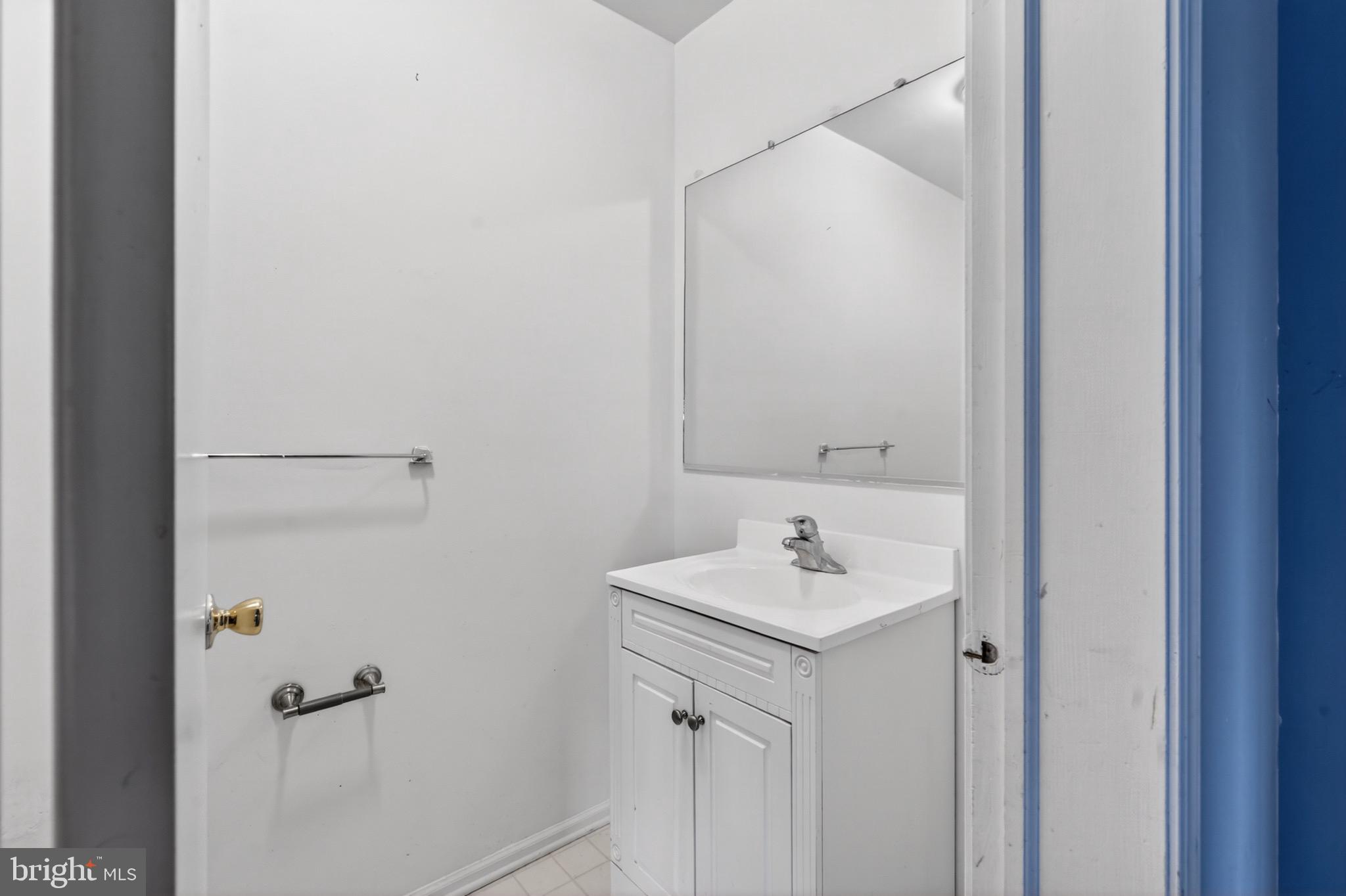 228 Goshen Road Schwenksville, PA 19473 - Photo 5 of 14 a bathroom with a sink and a mirror