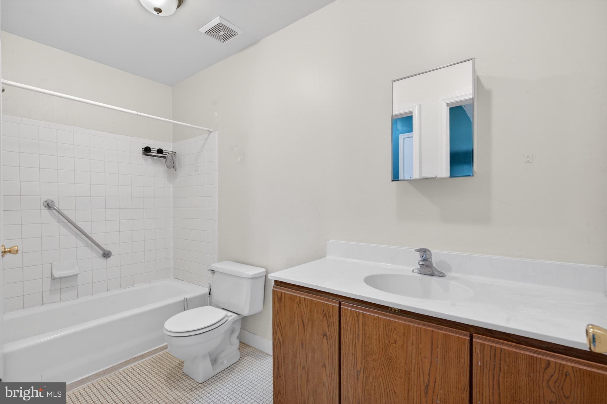 228 Goshen Road Schwenksville, PA 19473 - Photo 9 of 14 a bathroom with a sink a toilet and shower