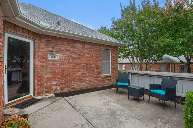 a backyard of a house with seating space