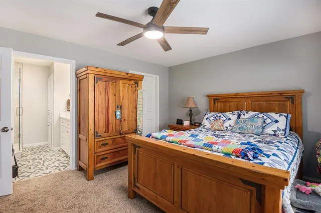 a bedroom with furniture and a bed