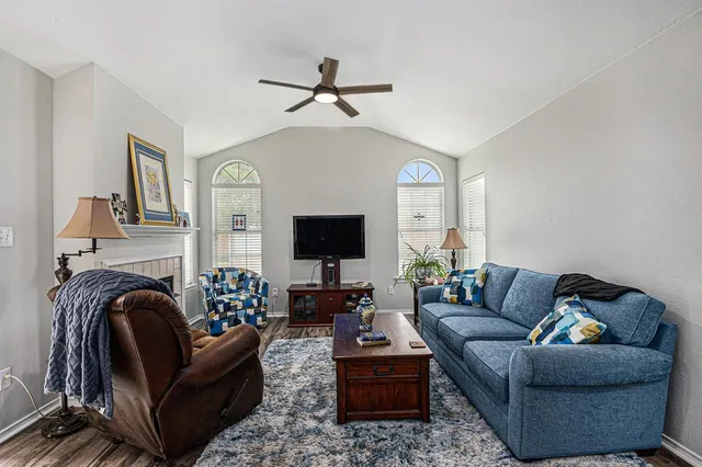 a living room with furniture and a flat screen tv