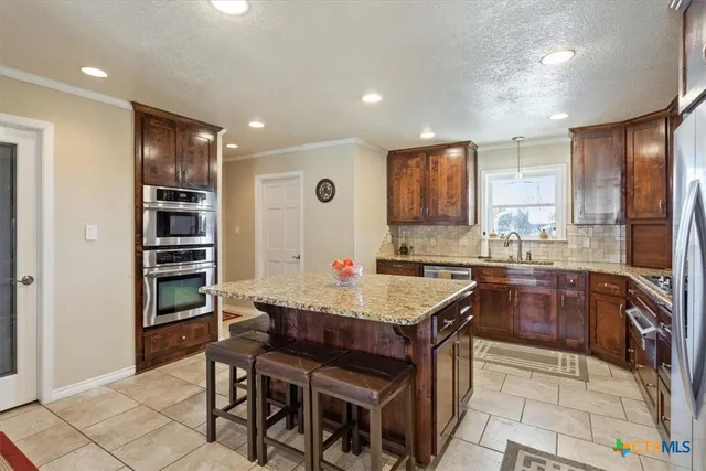 a view of yard covered with snow in front of house