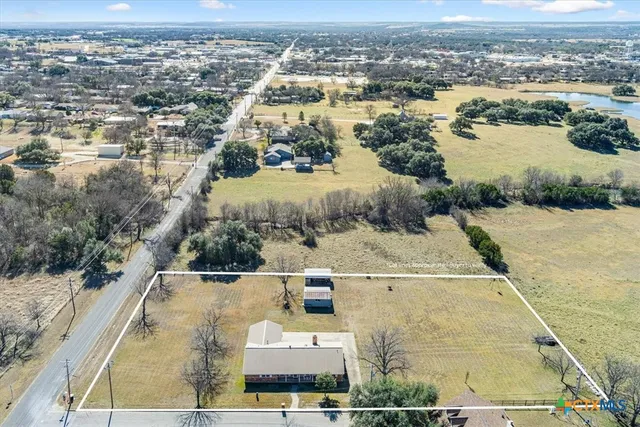 a living room with fireplace furniture and a wooden floor