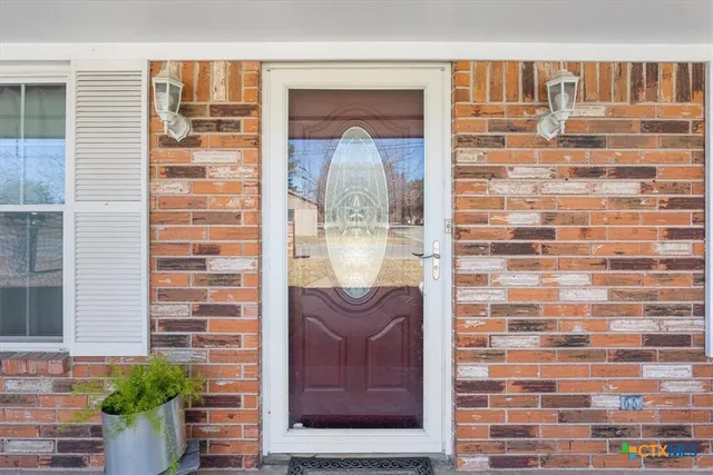 a kitchen with granite countertop stainless steel appliances wooden cabinets and a granite counter tops