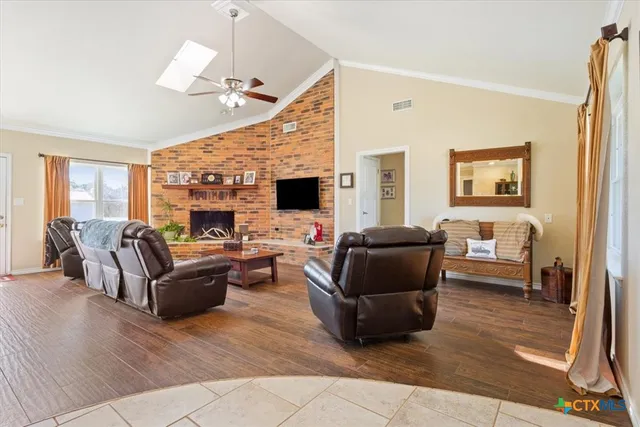 a bedroom with a bed and a tv on the dresser