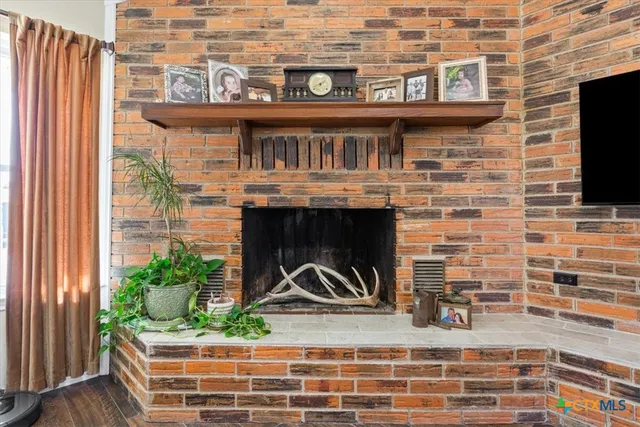 a bathroom with a granite countertop sink a mirror and a shower