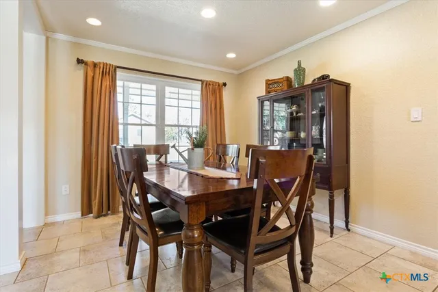 a bed sitting in a room next to a window