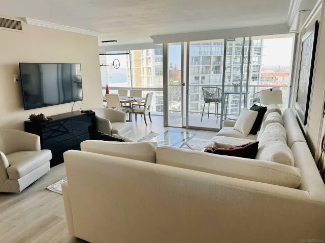 a kitchen with granite countertop wooden cabinets and sink