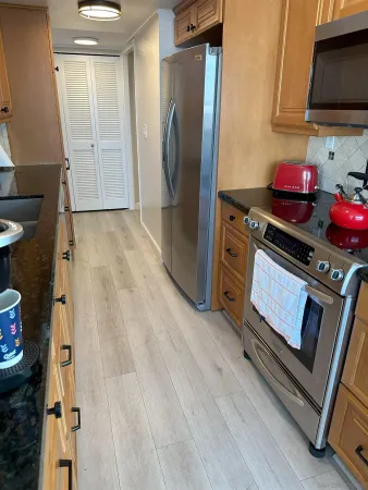 a spacious bathroom with a double vanity sink and mirror