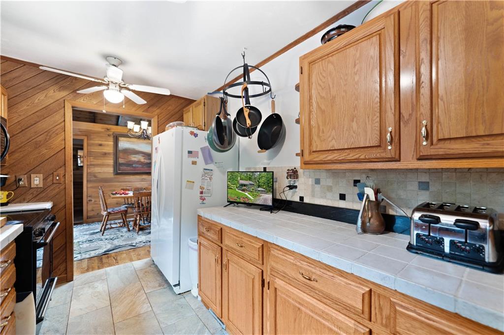 109 Fire Tower Road Confluence, PA 15424 - Photo 14 of 29 a kitchen with stainless steel appliances granite countertop a sink and cabinets