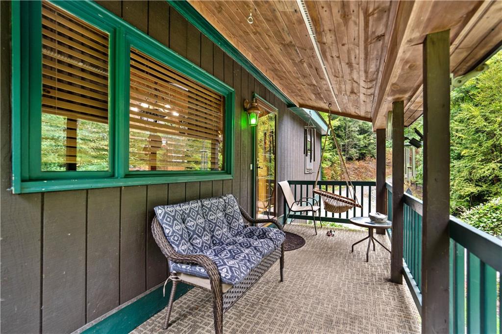 109 Fire Tower Road Confluence, PA 15424 - Photo 4 of 29 a view of a porch with furniture and a yard
