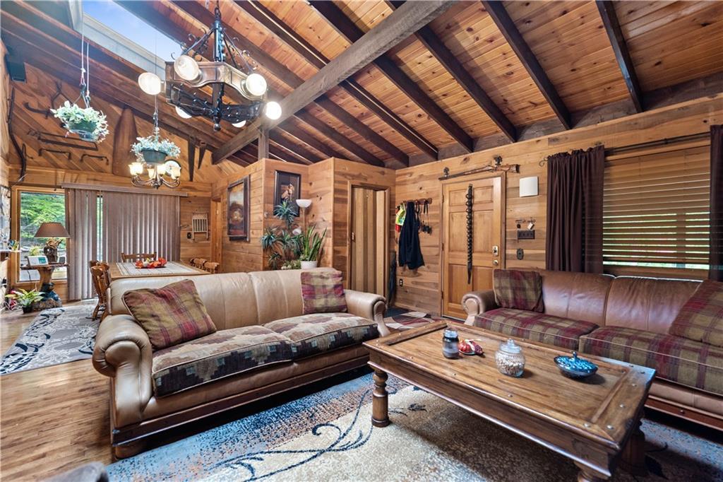 109 Fire Tower Road Confluence, PA 15424 - Photo 8 of 29 a living room with furniture and a chandelier