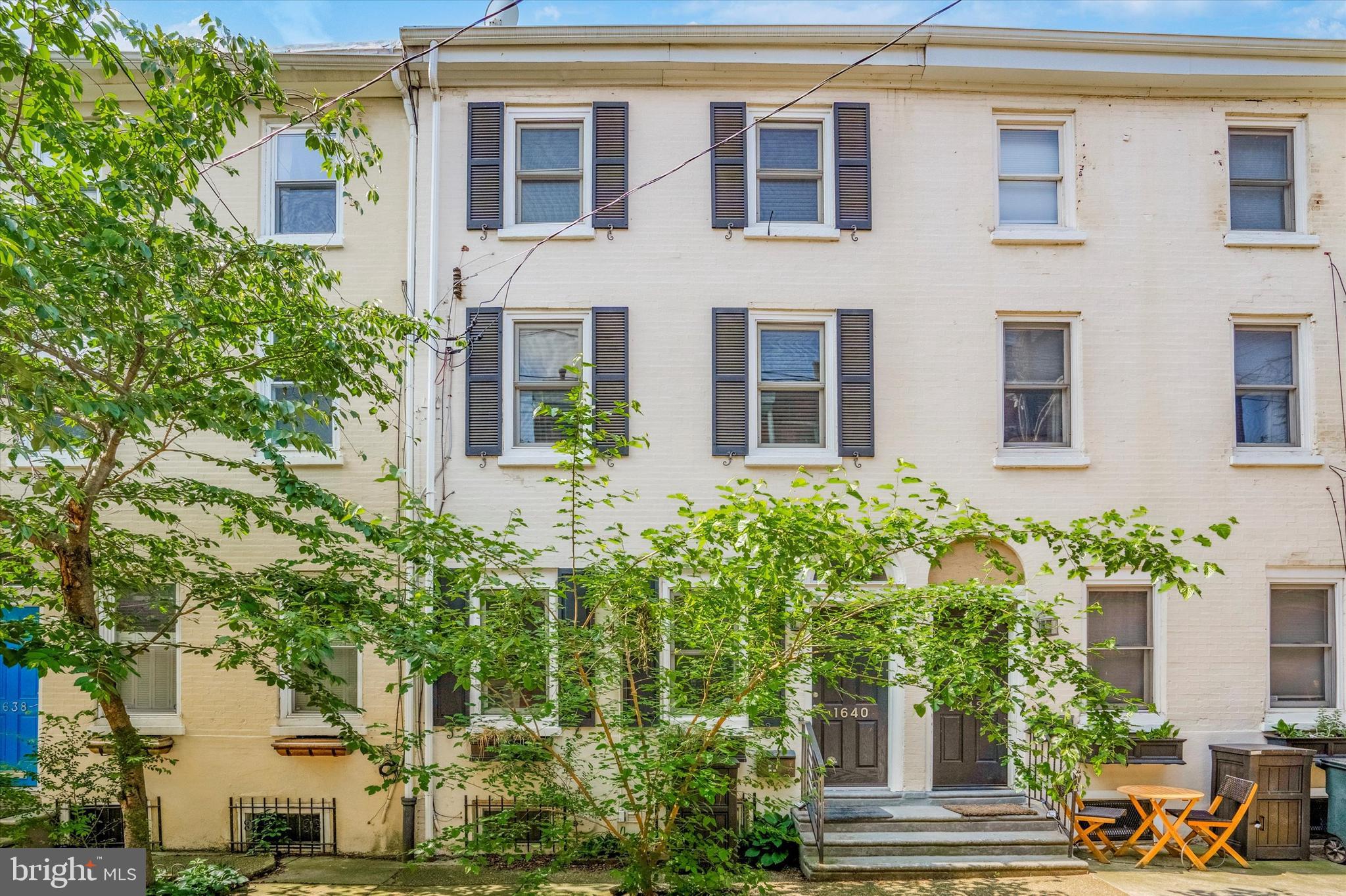 1640 Waverly Street Philadelphia, PA 19146 - Photo 1 of 16 a front view of a house with a yard