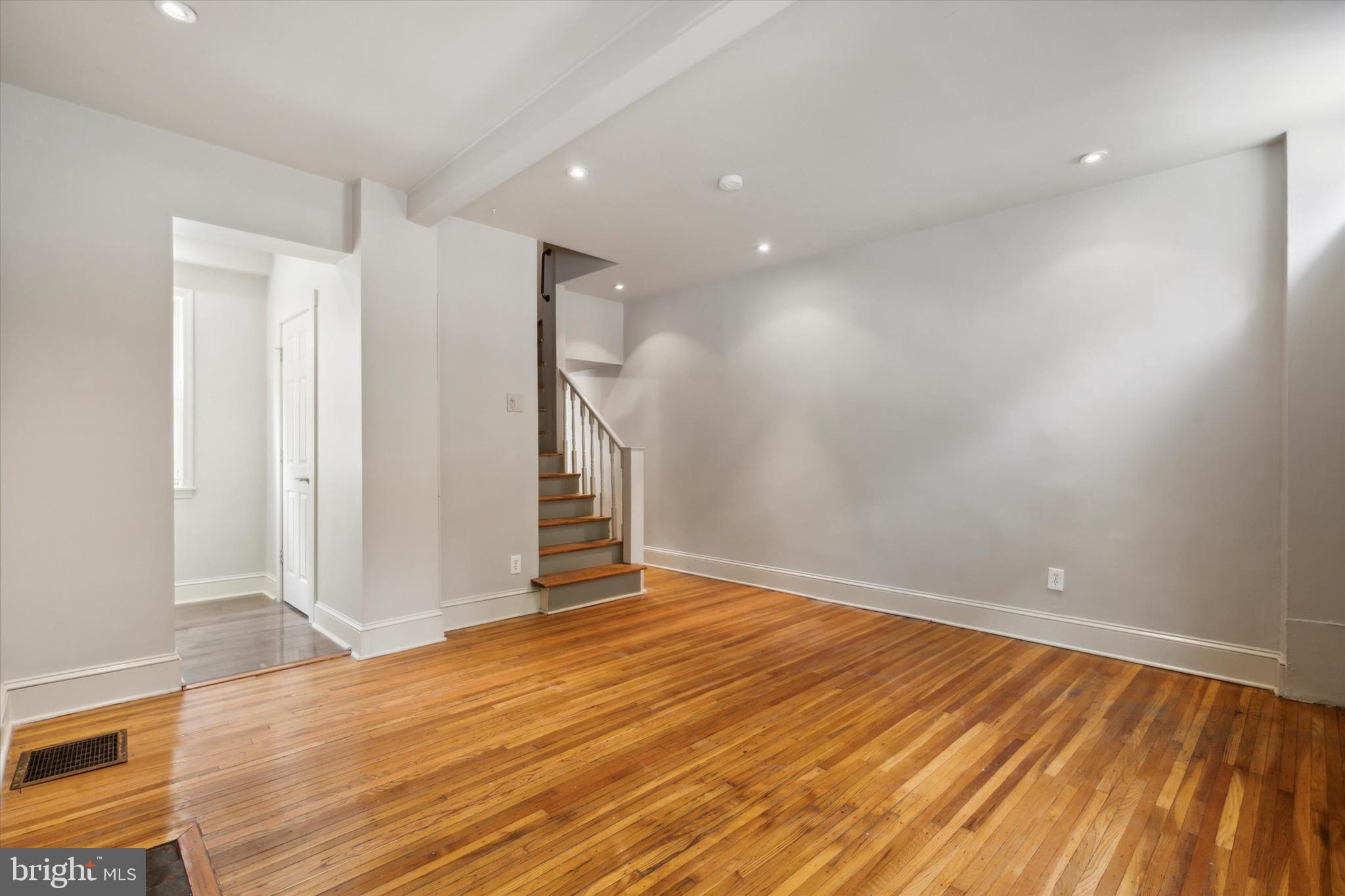 1640 Waverly Street Philadelphia, PA 19146 - Photo 3 of 16 wooden floor in an empty room with a window