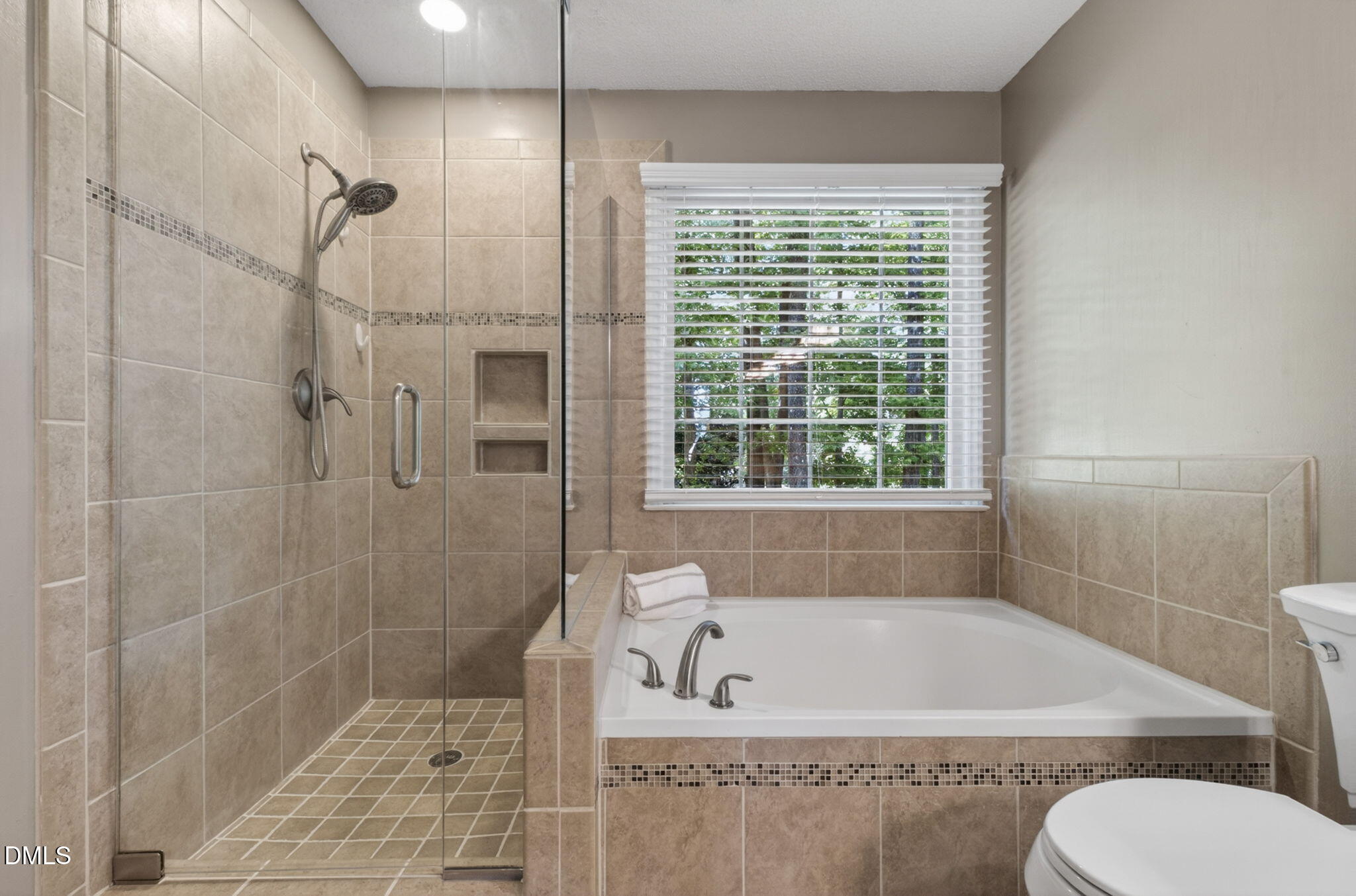 12113 Townmeade Court Raleigh, NC 27613 - Photo 27 of 39 Owner suite bathroom with soaking tub and shower.